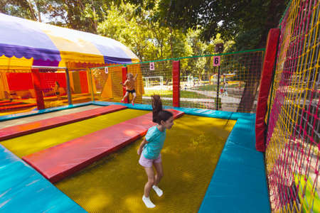 The joyful children are jumping in the trampoline parkの写真素材