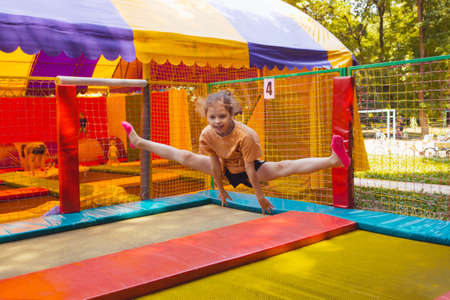 The joyful children are jumping in the trampoline parkの写真素材