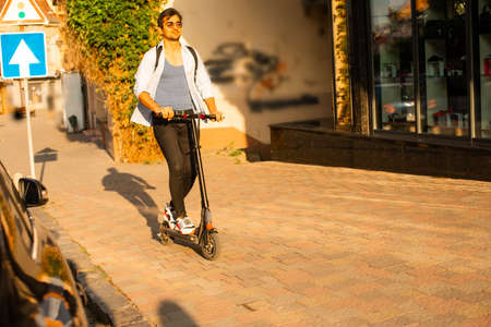 The high school student goes to study on a scooter