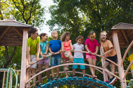 The group of friends spend time together in the playgroundの写真素材