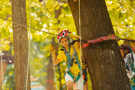 The cute preschooler are playing in the adventure parkの写真素材