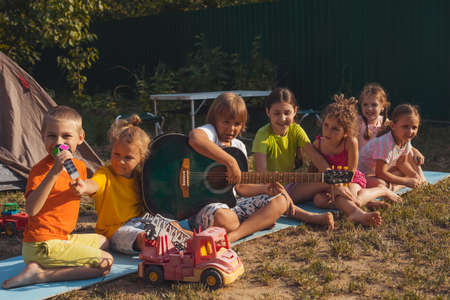 the children have a great time together in the backyard