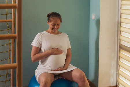 Woman gives birth at hospital, have a contractionの写真素材
