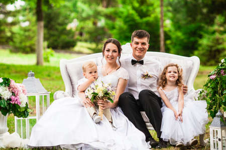 Happy wedding couple at the outdoor wedding decorの写真素材