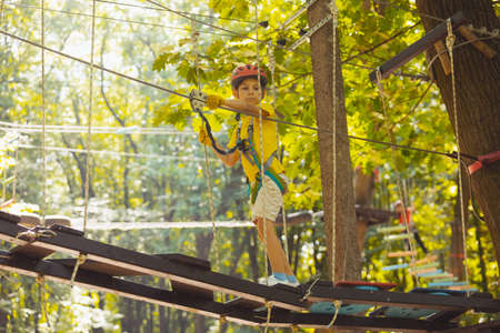 The cute preschooler are playing in the adventure park