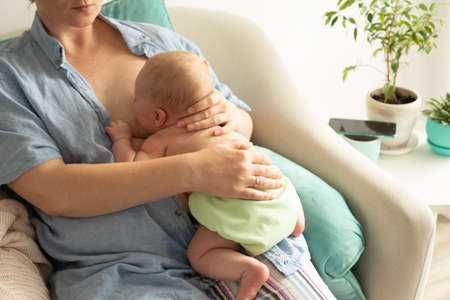Mothed and baby, breastfeeding in laid back position