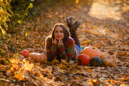 Portrait of happy smile woman with pumpkins in hand.の写真素材