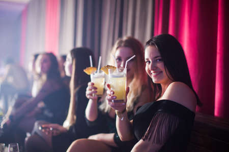 Group of dancing young people enjoying night in clubの写真素材