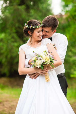 Happy bride and groom after wedding ceremonyの写真素材