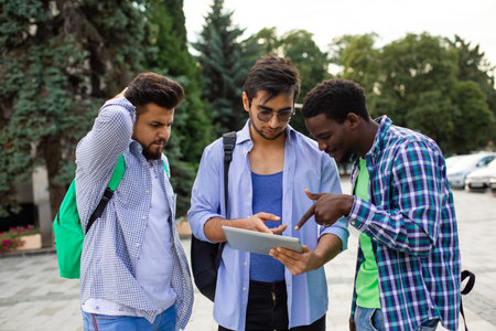 The group of indian students help your classmate with navigationの写真素材