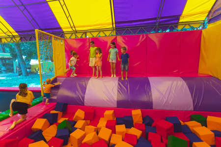 The children have a great time together in the trampoline parkの写真素材