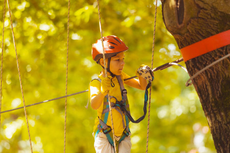 The cute preschooler are playing in the adventure parkの写真素材