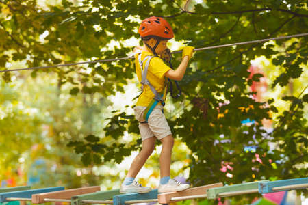 The cute preschooler are playing in the adventure parkの写真素材