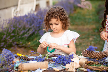 Girl creates homemade lavender wreath as a decorの写真素材