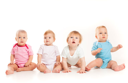 Four babies isolated isolated on white backgroundの写真素材