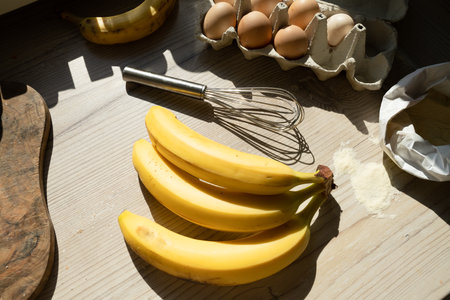 Ingredients for banana pastry, top view on the wooden tableの写真素材