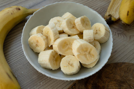 Sliced banana on the table at the kitchenの写真素材