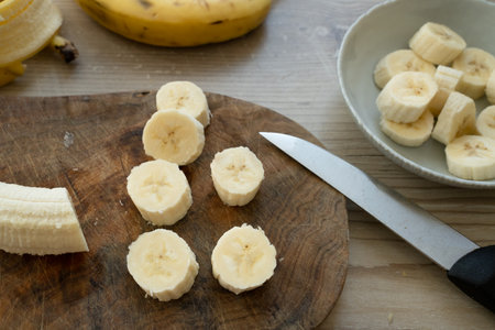 Sliced banana on the table at the kitchenの写真素材
