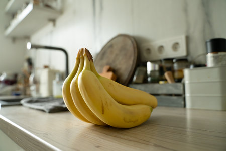 Bunch of bananas lying on the wooden backgroundの写真素材