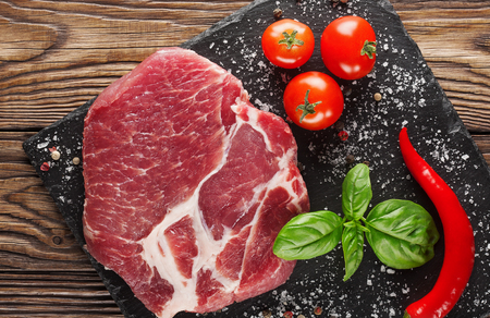 meat on a tree with tomatoes and pepperの写真素材