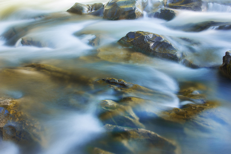 Big rocks in waterfalls of mountains river mountains. Water mountains landscape. Idea for outdoor activities, travel.の写真素材