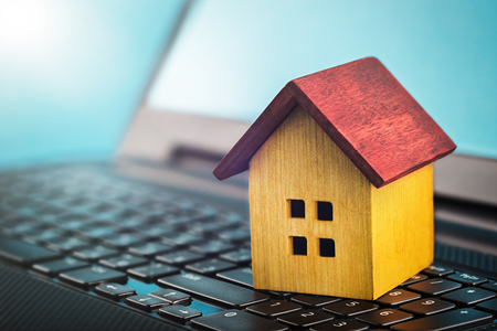 smart house concept, house on laptop keyboard. Idea for smart house, eco technology and computer monitoring, modern technology, IT and real estate.concept of computer security and protection.の写真素材