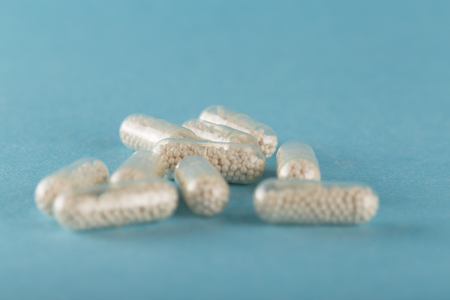 medical pills in granules from various diseases. Colorful tablets with space for textの写真素材