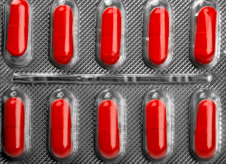 Ten useful red pills against pain closeupの写真素材