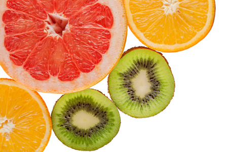 kiwi orange grapefruit on a white background