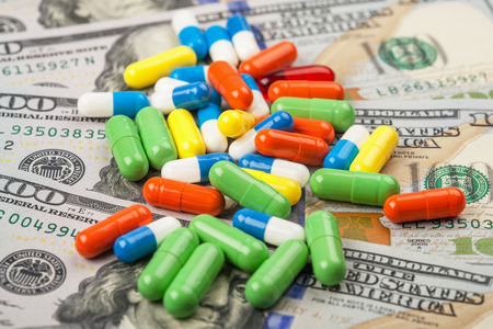 pills paid medicines and money to buy healthの写真素材