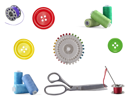 Sewing kit. Threads on the drums buttons for clothing and scissors.の写真素材