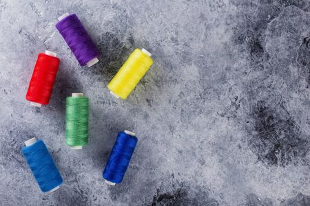 Colored spools of sewing thread. Top view for designers.