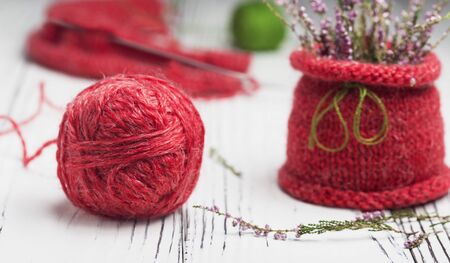 Knitting as a hobby. A large red ball of red thread.の写真素材