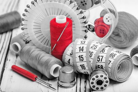 sewing kit from of colored thread buttons of needlesの写真素材