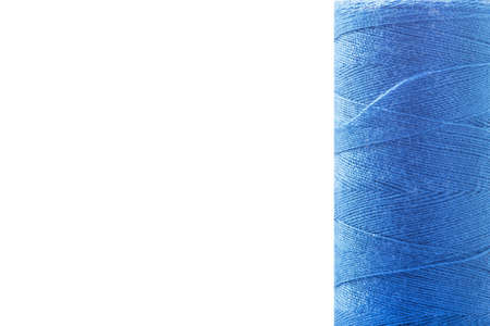 Sewing thread on a bobbin on a white backgroundの写真素材