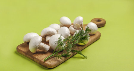 Mushrooms. Peeled fresh champignons on a cutting board.の写真素材