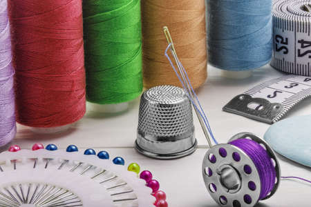 sewing kit from of colored thread buttons of needles
