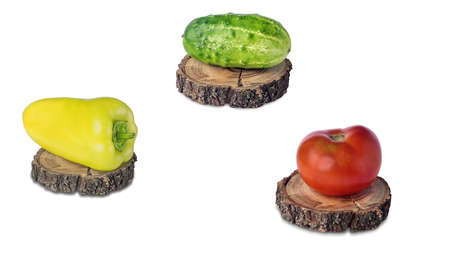 fresh red tomato, green cucumber and colorful bell pepper on wooden boardの写真素材