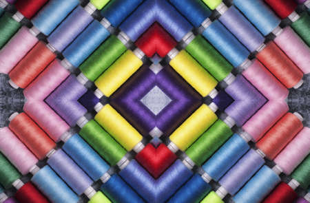Sewing threads on bobbins in pattern style.