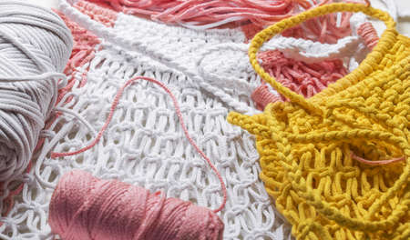 Macrame.Yellow and white woven cotton bag.