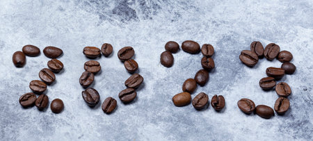 2023 year written with coffee beans top view