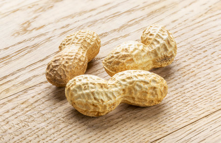 Peanut. A pod of peanut beans. close-up. On a wooden table.