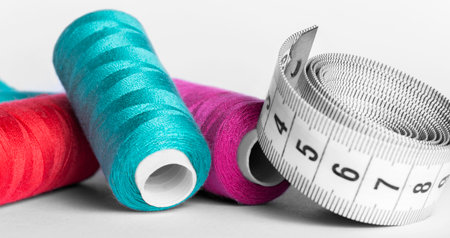 sewing thread on reels centimeter tape and sewing needleの写真素材