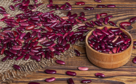 Red bean grains in a wooden bowl.の写真素材