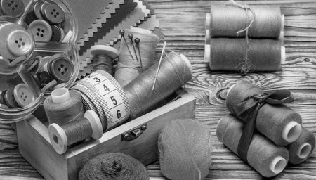 Black and white set. A small wooden box with threads on spools.の写真素材