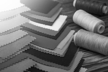 Black and white sewing kit. Sewing threads and fabric samples.の写真素材