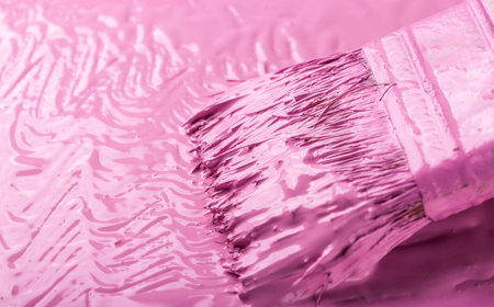 Brush with pink paint and pink background. repair concept.の写真素材