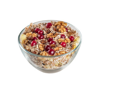 muesli with nuts, berries and raisins on a white background. Healthy breakfast.の写真素材