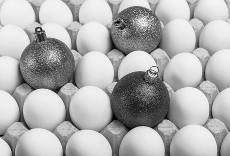 A lot of white eggs in a cardboard box. Eggs in a box close up