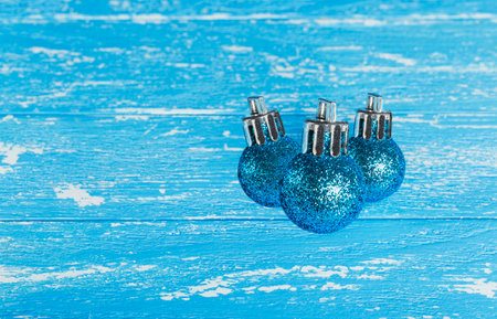 blue Christmas tree balls on a blue backgroundの写真素材
